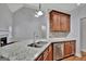 Modern kitchen featuring granite countertops, stainless steel appliances, and ample cabinet space at 90 Barrington Grange Dr, Sharpsburg, GA 30277