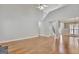 Spacious living room features hardwood floors, high ceilings, and neutral paint, creating a bright and welcoming space at 90 Barrington Grange Dr, Sharpsburg, GA 30277