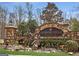 The Country Hills Estates entrance features stonework, statues and landscaping at 465 Belada Blvd, Sandy Springs, GA 30342