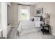 Comfortable bedroom with large window, plush carpeting, and neutral paint at 2070 Fortuna St, Lawrenceville, GA 30046
