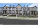 Charming brick townhomes featuring a modern design and well-maintained landscaping at 2070 Fortuna St, Lawrenceville, GA 30046