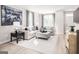 Cozy living room with neutral decor, large windows, and ample natural light at 2070 Fortuna St, Lawrenceville, GA 30046