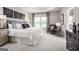 Serene main bedroom featuring tray ceiling, soft lighting, and ensuite bathroom access at 2070 Fortuna St, Lawrenceville, GA 30046