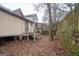View of backyard, showing a wooden fence and stone wall at 613 Mc Donald Se St, Atlanta, GA 30312