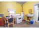 Small kitchen with yellow walls and stove at 613 Mc Donald Se St, Atlanta, GA 30312