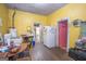 Small kitchen with yellow walls and white appliances at 613 Mc Donald Se St, Atlanta, GA 30312
