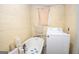 Small laundry room with washer, bathtub, and storage at 613 Mc Donald Se St, Atlanta, GA 30312