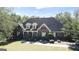 Two-story brick home, landscaped yard, and driveway at 168 Robson Trl, Mcdonough, GA 30252