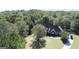 House nestled in a wooded lot with driveway at 168 Robson Trl, Mcdonough, GA 30252
