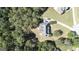 Aerial view of house, large lot, and surrounding trees at 168 Robson Trl, Mcdonough, GA 30252