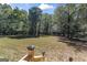 Large backyard with grassy area and wooded backdrop at 168 Robson Trl, Mcdonough, GA 30252