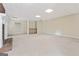 Finished basement with fireplace and neutral carpeting at 168 Robson Trl, Mcdonough, GA 30252