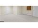 Large finished basement bedroom with neutral carpeting at 168 Robson Trl, Mcdonough, GA 30252