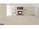 Finished basement featuring a brick fireplace and French doors at 168 Robson Trl, Mcdonough, GA 30252