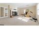 Spacious basement recreation room with fireplace and home gym at 168 Robson Trl, Mcdonough, GA 30252