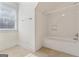 Simple bathroom with shower/tub combo and tile flooring at 168 Robson Trl, Mcdonough, GA 30252