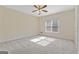 Bright and airy bedroom with ceiling fan and large window at 168 Robson Trl, Mcdonough, GA 30252