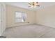 Spacious bedroom with ceiling fan and window coverings at 168 Robson Trl, Mcdonough, GA 30252