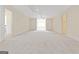 Large bedroom featuring carpet, a ceiling fan and multiple doors at 168 Robson Trl, Mcdonough, GA 30252