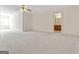 Spacious bedroom with carpet, a ceiling fan and access to bathroom at 168 Robson Trl, Mcdonough, GA 30252