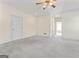 Spacious bedroom with carpeted floors at 168 Robson Trl, Mcdonough, GA 30252