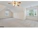 Bright bedroom featuring neutral walls, carpet, and multiple windows at 168 Robson Trl, Mcdonough, GA 30252