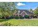 Brick house with a large front yard and mature trees at 168 Robson Trl, Mcdonough, GA 30252