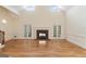 Two-story Gathering room with hardwood floors, fireplace and high ceilings at 168 Robson Trl, Mcdonough, GA 30252
