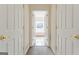 Hallway with carpet and doors to other rooms at 168 Robson Trl, Mcdonough, GA 30252