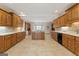 Large kitchen with island and abundant wood cabinetry at 168 Robson Trl, Mcdonough, GA 30252