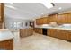 Spacious kitchen with island, ample cabinetry, and tile flooring at 168 Robson Trl, Mcdonough, GA 30252