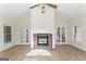 Sunroom with brick fireplace and French doors at 168 Robson Trl, Mcdonough, GA 30252