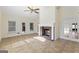 Sunroom with a ceiling fan and brick fireplace at 168 Robson Trl, Mcdonough, GA 30252