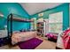 Bright bedroom with bunk beds and a colorful rug at 4240 N Braves Cir, Douglasville, GA 30135