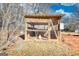 Wooden chicken coop with wire mesh and water source at 120 Dixie Trl, Covington, GA 30014