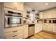 Modern kitchen with stainless steel appliances and white cabinets at 120 Dixie Trl, Covington, GA 30014