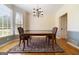 Formal dining room with hardwood floors, chandelier and bay windows at 308 Bell Isle, Mcdonough, GA 30252