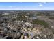Neighborhood overview with lake and surrounding homes at 295 Camden Creek Ct, Lawrenceville, GA 30043