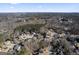 Aerial view of a residential neighborhood with houses and trees at 295 Camden Creek Ct, Lawrenceville, GA 30043