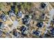 Aerial view of neighborhood featuring a cul-de-sac and multiple homes with pools at 295 Camden Creek Ct, Lawrenceville, GA 30043