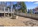 Landscaped backyard with deck and privacy fence at 295 Camden Creek Ct, Lawrenceville, GA 30043