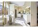 Spa-like Primary bathroom with soaking tub, separate shower, and double vanity at 295 Camden Creek Ct, Lawrenceville, GA 30043