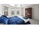 Spacious bedroom with a blue comforter, large windows, and a walk-in closet at 295 Camden Creek Ct, Lawrenceville, GA 30043