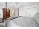 Bright bedroom featuring a ceiling fan and ample closet space at 295 Camden Creek Ct, Lawrenceville, GA 30043