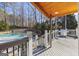 Large deck with built-in grill and views of the inground pool at 295 Camden Creek Ct, Lawrenceville, GA 30043