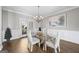 Bright dining room with hardwood floors and a glass-top table at 295 Camden Creek Ct, Lawrenceville, GA 30043