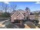 Two-story brick home with a welcoming front porch and driveway at 295 Camden Creek Ct, Lawrenceville, GA 30043