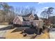 Two-story brick home with a large yard and landscaping at 295 Camden Creek Ct, Lawrenceville, GA 30043