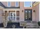 Brick house exterior with double doors and porch at 295 Camden Creek Ct, Lawrenceville, GA 30043