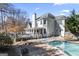 Two-story house exterior with deck and pool in the backyard at 295 Camden Creek Ct, Lawrenceville, GA 30043
